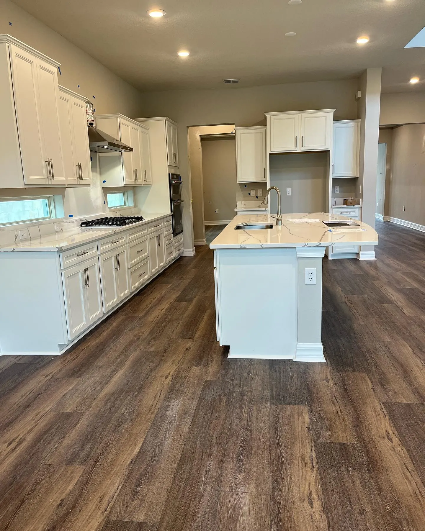Premium vinyl plank in a modern kitchen with white cabinets